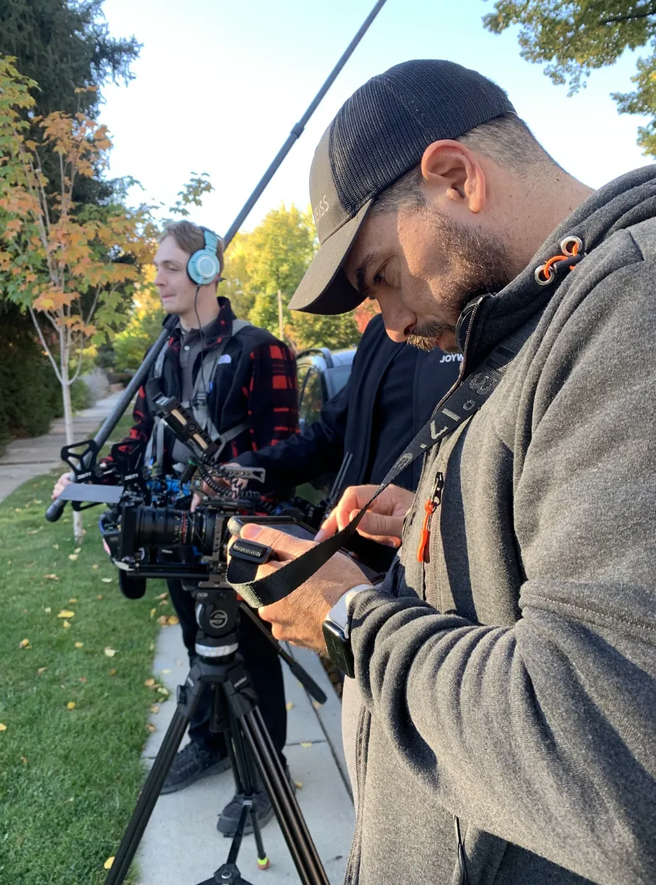 Camera operator and boom operator setting up on a residential street